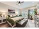 Comfortable bedroom featuring hardwood floors, bright light from the french doors, and relaxing decor at 4965 Dover St, Arvada, CO 80002