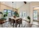 Dining room with modern lighting, large windows, and beautiful accents, creating an elegant space at 4965 Dover St, Arvada, CO 80002