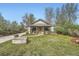 Charming single story home featuring a covered front porch, mature landscaping, and a well manicured lawn at 4965 Dover St, Arvada, CO 80002