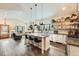 Spacious kitchen featuring an island with bar stool seating and open design into living area at 4965 Dover St, Arvada, CO 80002