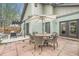 Outdoor patio with table, chairs, and umbrella, perfect for entertaining or relaxing at 4965 Dover St, Arvada, CO 80002