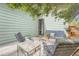 Outdoor patio area features comfortable seating surrounded by lush greenery, offering a private retreat at 4965 Dover St, Arvada, CO 80002