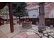 Outdoor patio with a stone fire pit, mature trees, and privacy fence at 16873 Boreas Ct, Parker, CO 80134