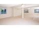 Spacious basement area featuring light-colored walls and carpet and windows providing ample natural light at 16873 Boreas Ct, Parker, CO 80134