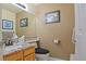 Powder room featuring decorative mirror, granite countertop, and stylish fixtures at 16873 Boreas Ct, Parker, CO 80134