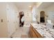 Well-lit bathroom with marble countertop and corner soaking tub at 16873 Boreas Ct, Parker, CO 80134