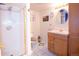 A full bathroom featuring a glass enclosed shower, single sink vanity and tile flooring at 16873 Boreas Ct, Parker, CO 80134