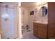 Bathroom with a glass door shower, single vanity, and tiled floors at 16873 Boreas Ct, Parker, CO 80134