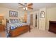 Comfortable bedroom with blue patterned bedding and ceiling fan at 16873 Boreas Ct, Parker, CO 80134