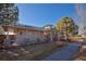 Well-maintained community center with stone accents, covered porch, and tidy landscaping on a sunny day at 16873 Boreas Ct, Parker, CO 80134