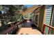 Inviting covered outdoor deck with awning for shade, perfect for relaxing or entertaining guests at 16873 Boreas Ct, Parker, CO 80134