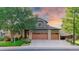 Inviting two-story home features a three-car garage, lush landscaping and a well-maintained lawn at 16873 Boreas Ct, Parker, CO 80134