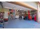 Spacious garage with painted floor and ample storage shelves at 16873 Boreas Ct, Parker, CO 80134