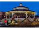 Picturesque gazebo adorned with festive lights and holiday decorations at twilight providing a cozy and inviting community space at 16873 Boreas Ct, Parker, CO 80134