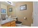 Stylish half bathroom with granite counters, modern fixtures, and decorative artwork at 16873 Boreas Ct, Parker, CO 80134