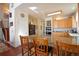 Bright kitchen featuring granite countertops, stainless steel appliances, and a breakfast bar at 16873 Boreas Ct, Parker, CO 80134