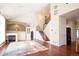 Bright living room with vaulted ceiling, hardwood floors, fireplace, and an open floor plan at 16873 Boreas Ct, Parker, CO 80134