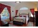 Bright main bedroom boasts a large window and vaulted ceiling at 16873 Boreas Ct, Parker, CO 80134