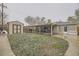 Large backyard featuring a storage shed, covered patio with seating, and ample green space at 9391 Lilly Ct, Thornton, CO 80229