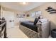 This is a nice bedroom with a comfortable bed, modern furnishings, and neutral color palette at 9391 Lilly Ct, Thornton, CO 80229