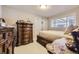 Bedroom featuring a well-lit room with a decorative wood dresser and accents at 9391 Lilly Ct, Thornton, CO 80229