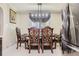 Formal dining area featuring a decorative table setting with custom chairs and lighting at 9391 Lilly Ct, Thornton, CO 80229