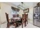 Sophisticated dining room with ornate chairs and modern lighting fixture at 9391 Lilly Ct, Thornton, CO 80229