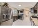 Modern kitchen with stainless steel appliances and neutral-toned cabinetry at 9391 Lilly Ct, Thornton, CO 80229