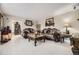 Luxurious living room featuring elegant furniture, tile flooring, and stylish decor at 9391 Lilly Ct, Thornton, CO 80229