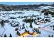 Aerial view of the property showcasing its mountain town location and picturesque, snow-covered surroundings at 59 Gold Run Rd, Breckenridge, CO 80424