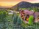 Stunning aerial view of the property showing the surrounding landscape and mountain views at sunset at 59 Gold Run Rd, Breckenridge, CO 80424