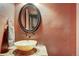 Modern half bath features a unique stone bowl sink and a rustic painted wall at 59 Gold Run Rd, Breckenridge, CO 80424