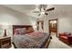 Bedroom with ceiling fan, carpeted floors, neutral paint, and ensuite access at 59 Gold Run Rd, Breckenridge, CO 80424