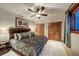 Bedroom with ceiling fan, carpeted floors, neutral paint, and ensuite access at 59 Gold Run Rd, Breckenridge, CO 80424