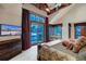 Spacious main bedroom features a balcony with views of the snowy mountain landscape beyond at 59 Gold Run Rd, Breckenridge, CO 80424