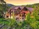 Beautiful home with stone accents, expansive windows, and mountain views at 59 Gold Run Rd, Breckenridge, CO 80424