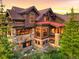 Attractive home with stone accents, expansive windows, and a beautiful outdoor deck at 59 Gold Run Rd, Breckenridge, CO 80424