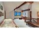 Spacious game room with a shuffleboard table, exposed beams, and seating areas at 59 Gold Run Rd, Breckenridge, CO 80424