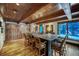 Open floor plan boasts a large kitchen island, custom wood cabinets and stainless refrigerator at 59 Gold Run Rd, Breckenridge, CO 80424