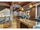 Elegant kitchen with wood beams, a large island, and stainless steel appliances at 59 Gold Run Rd, Breckenridge, CO 80424