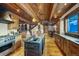 This open kitchen features a stainless oven, central island with sink, and an inviting dining area at 59 Gold Run Rd, Breckenridge, CO 80424