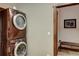 Modern stackable washer and dryer set conveniently located near an additional area with a bench at 59 Gold Run Rd, Breckenridge, CO 80424