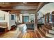 Elegant living space with hardwood floors, stone fireplace, and a staircase with wooden steps at 59 Gold Run Rd, Breckenridge, CO 80424
