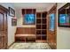 Charming mud room features built-in bench seating, custom storage and decoratively tiled floor at 59 Gold Run Rd, Breckenridge, CO 80424