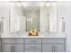 Modern bathroom with double vanity and walk-in shower at 10860 Lyric St, Lone Tree, CO 80134