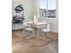 Bright dining area with a light wood table and four chairs at 10860 Lyric St, Lone Tree, CO 80134