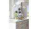 Kitchen island with sink, faucet, and pendant lighting at 10860 Lyric St, Lone Tree, CO 80134