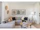 Living area with grey sectional sofa and floor lamp at 10860 Lyric St, Lone Tree, CO 80134