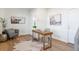 Home office with wood desk and cowhide rug at 10860 Lyric St, Lone Tree, CO 80134