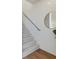 Modern staircase with light grey carpet and metal railing at 10860 Lyric St, Lone Tree, CO 80134